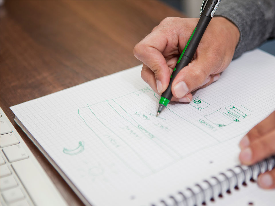 designer sketching wireframes image